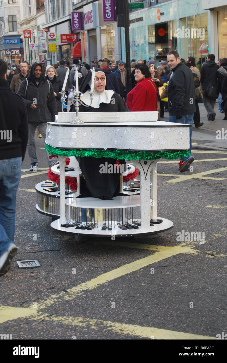 Oxford street Christmas sales Nun Stock Photo Alamy
