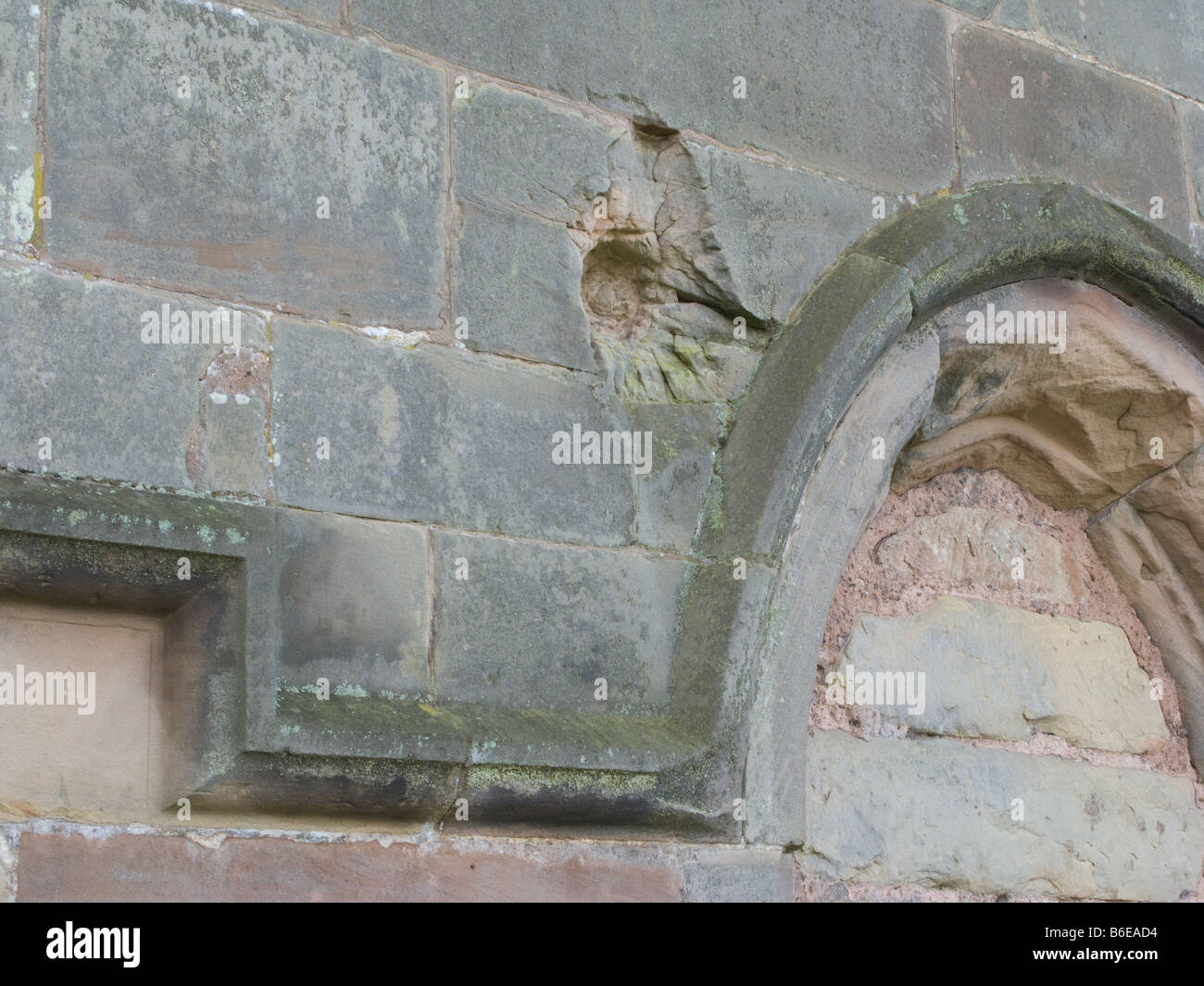 English civil war cannonball hole in church wall, Tong, Shropshire Stock Photo
