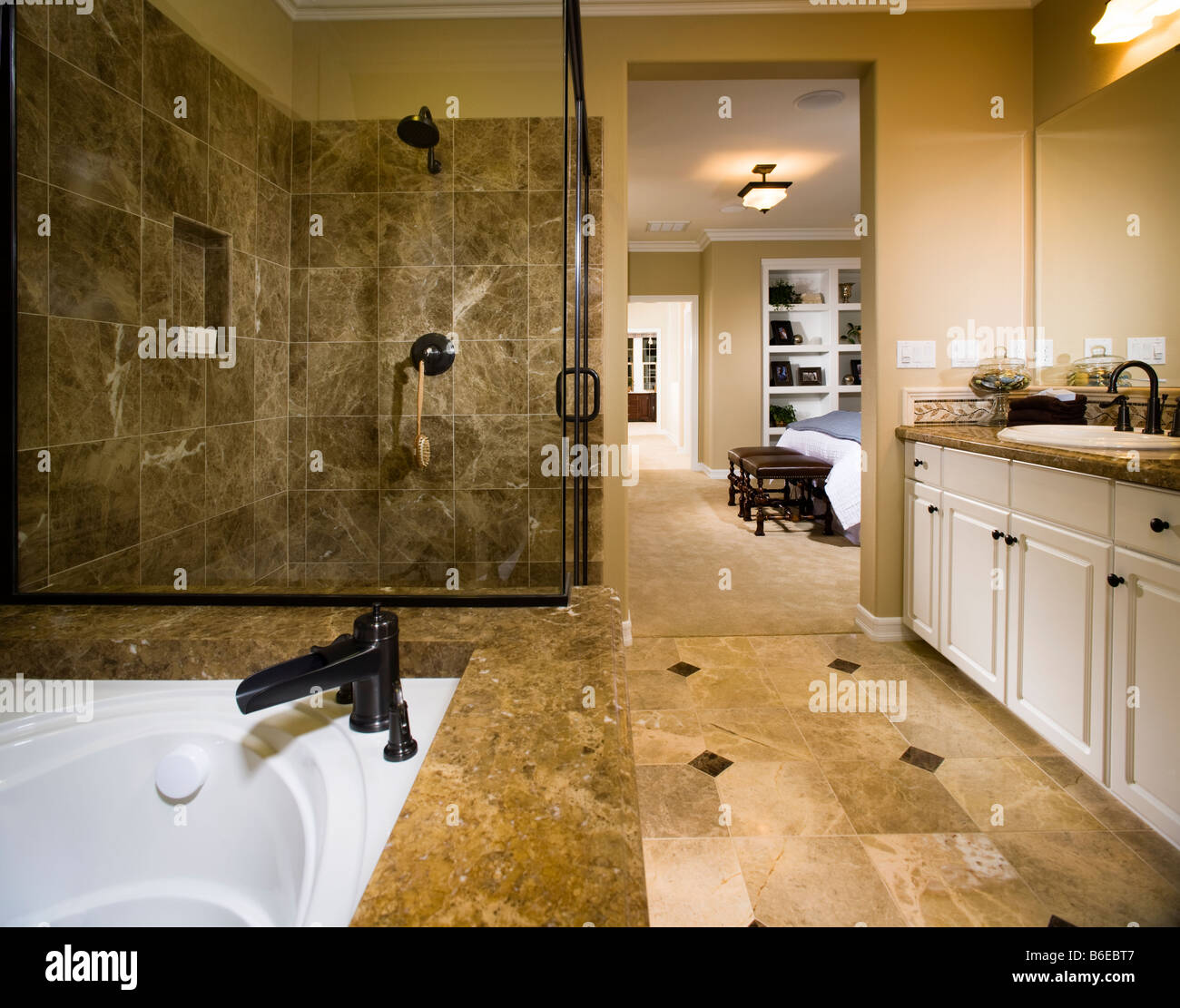 Master bathroom with large tub and glass shower Stock Photo - Alamy