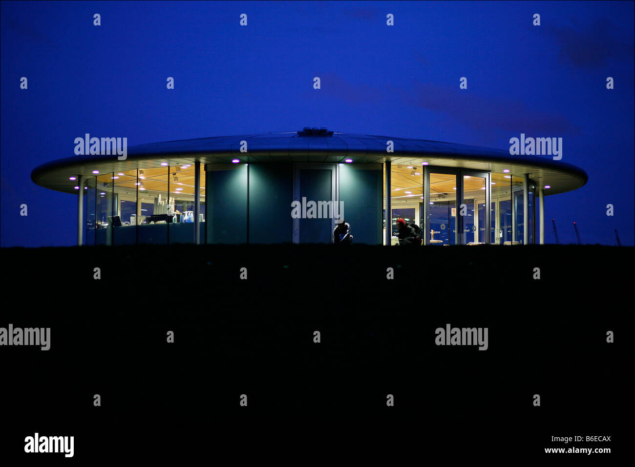 Regents park cafe illuminated at dusk Stock Photo Alamy