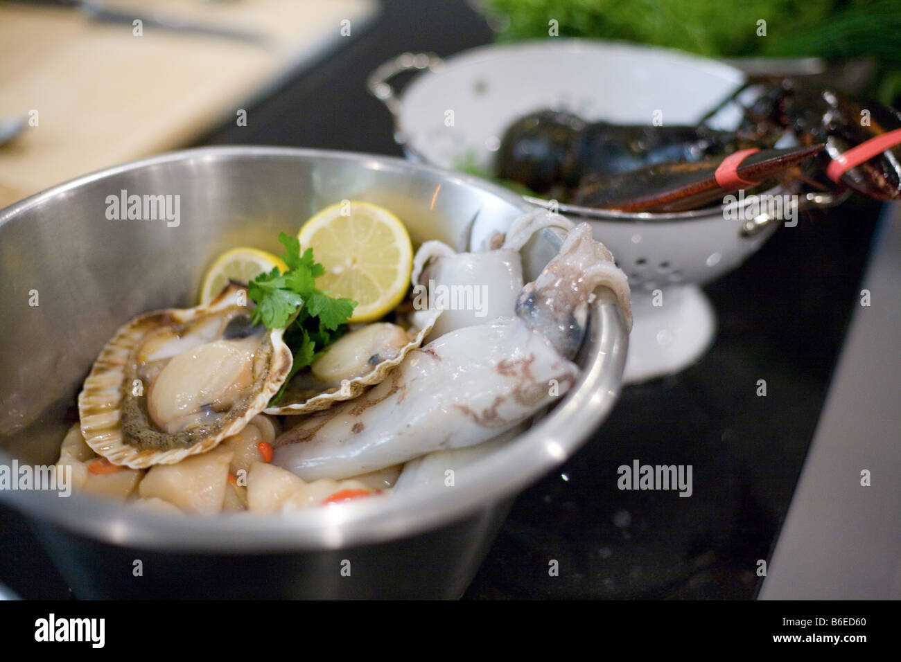 fresh shellfish in metallic bowl. Stock Photo
