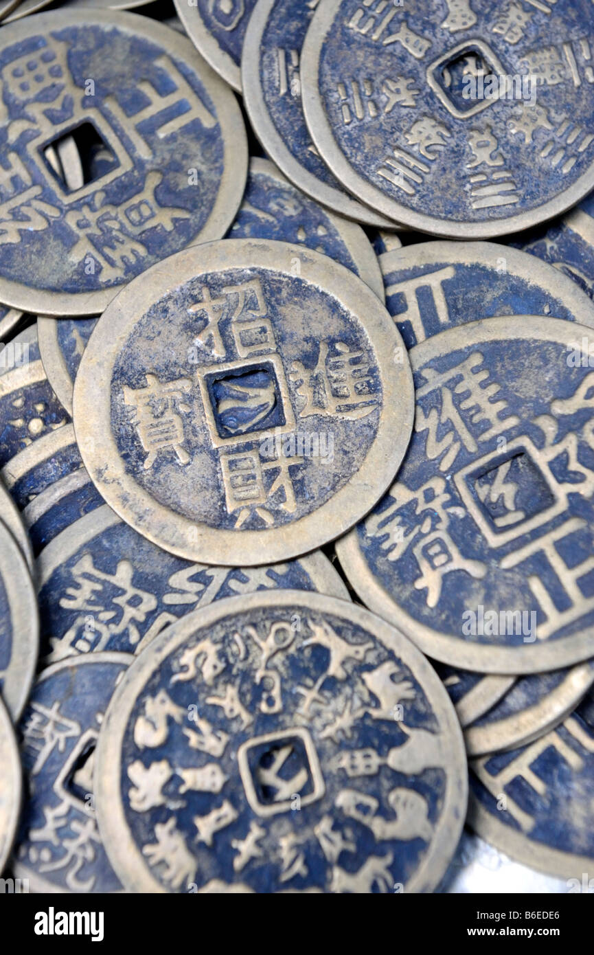Old Chinese coins on sale at the Cat Street antique market Hong Kong, China Stock Photo