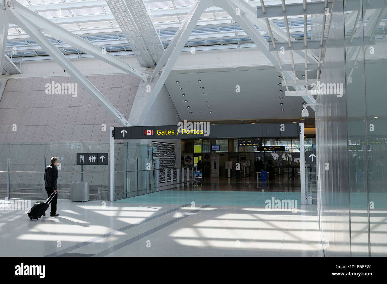 Passenger entering departure gates to domestic flights at Pearson International Airport Terminal 1 Toronto Canada Stock Photo