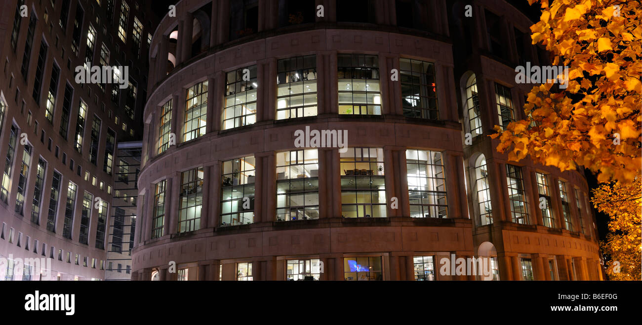 Panorama of the Central Branch of the Vancouver Public Library at night with yellow leaves in the Fall Stock Photo