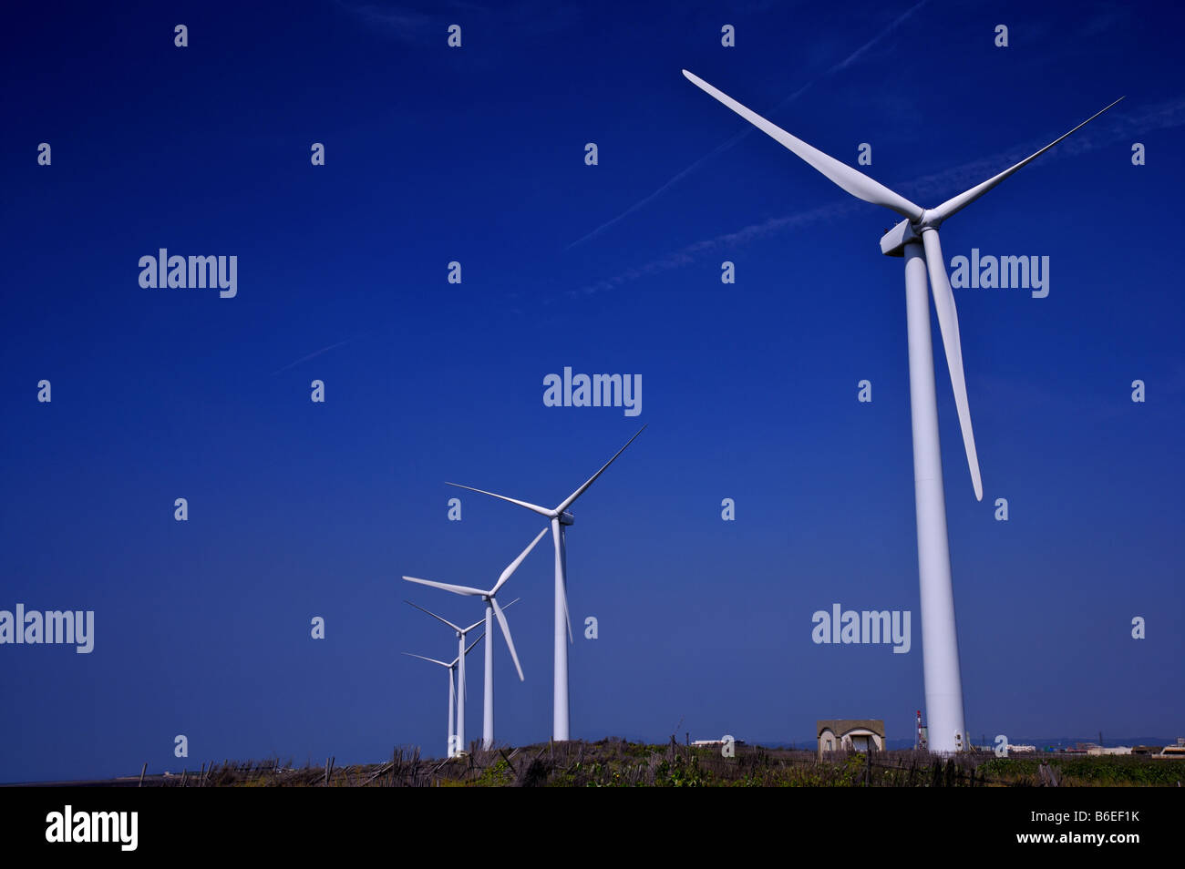 White wind turbines against a clear blue sky Stock Photo - Alamy
