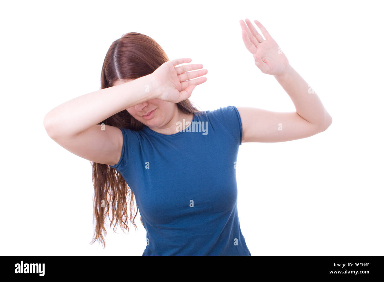Woman protecting herself from aggression. Domestic violence Stock Photo