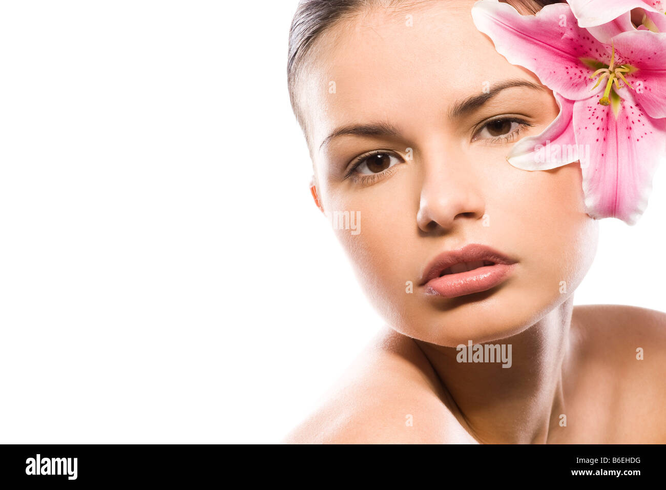 portrait of beautiful woman with pink lily Stock Photo