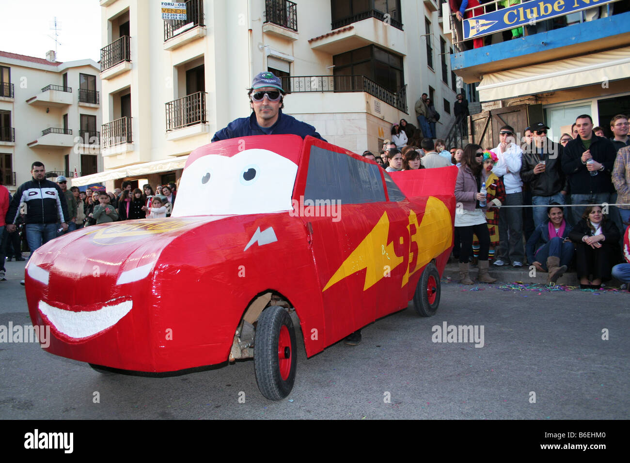 Carnival parody about the animation film “Cars” with Lightning McQueen character portrayed. Sesimbra Carnival (Portugal). Stock Photo