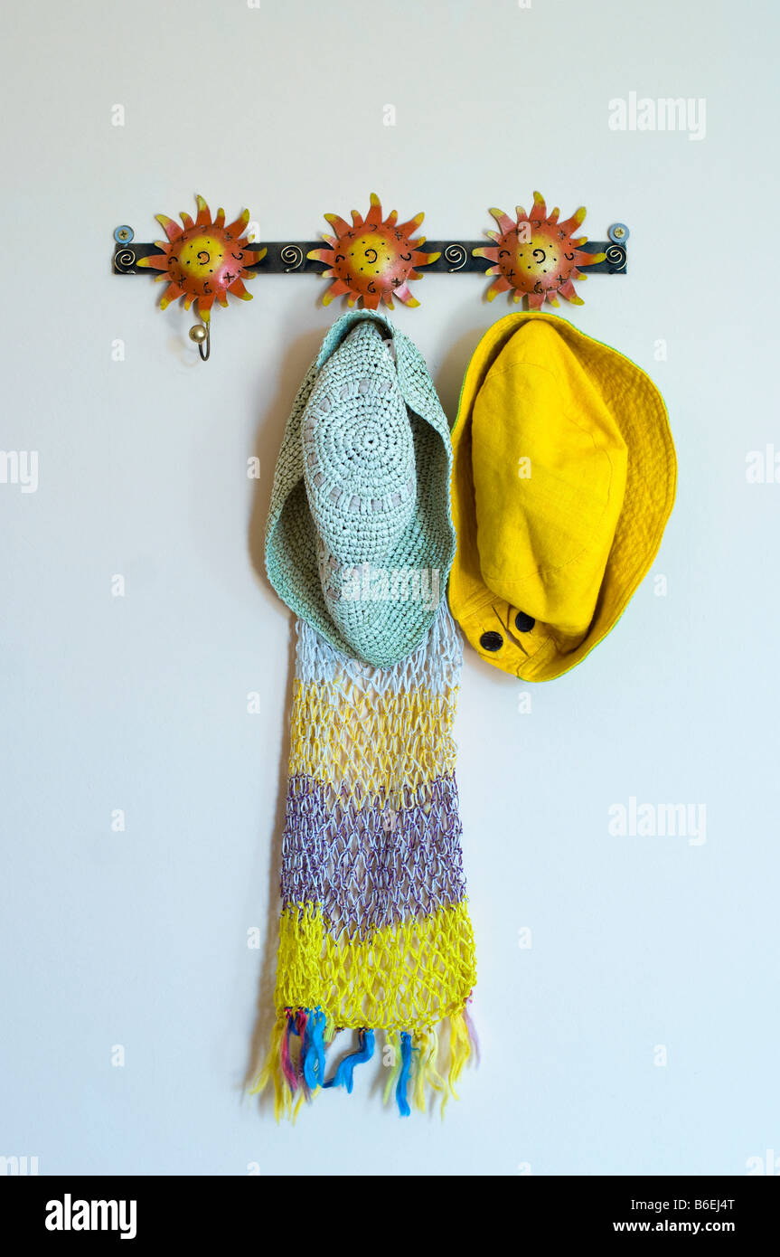 Coat rack with hats and scarf Stock Photo Alamy