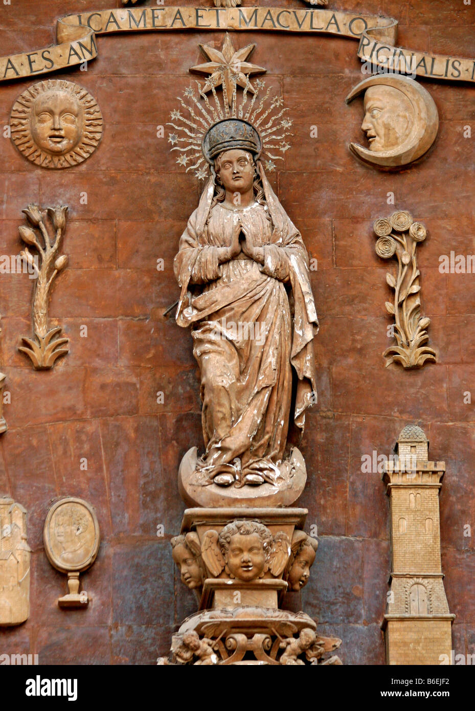 Sculpture of the Virgin Mary with symbols, sun, cypress, lily, moon, mirror, Renaissance main portal, Portal Major, La Seu Cath Stock Photo