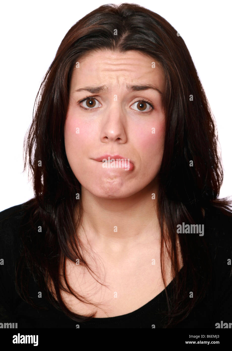 Young woman looking confused Stock Photo