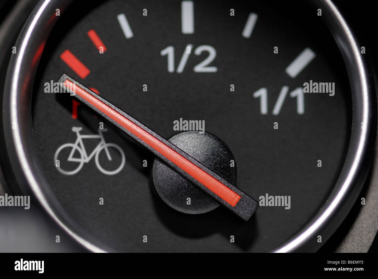 Empty fuel gauge showing the image of a bicycle, symbolic photo for high petrol prices Stock Photo
