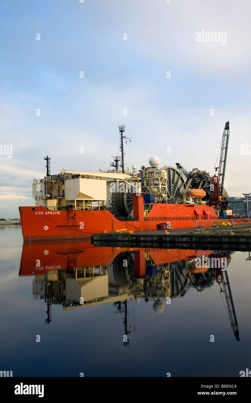 Abstract reflections, Cable & Pipelayers, Pipelay Vessel CSO Apache, a pipe-laying vessel reflected in the dock, at Edinburgh Port of Leith, Scotland Stock Photo