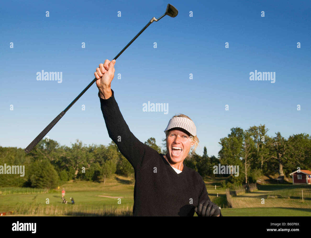Woman succeed in golf Stock Photo