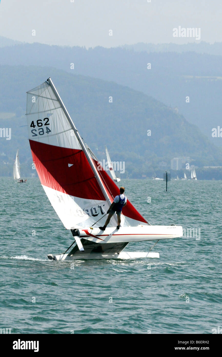 Yachtsman with catamaran during a sailing manoeuvre near Wasserburg, Lake Constance, Bavaria, Germany, Europe Stock Photo