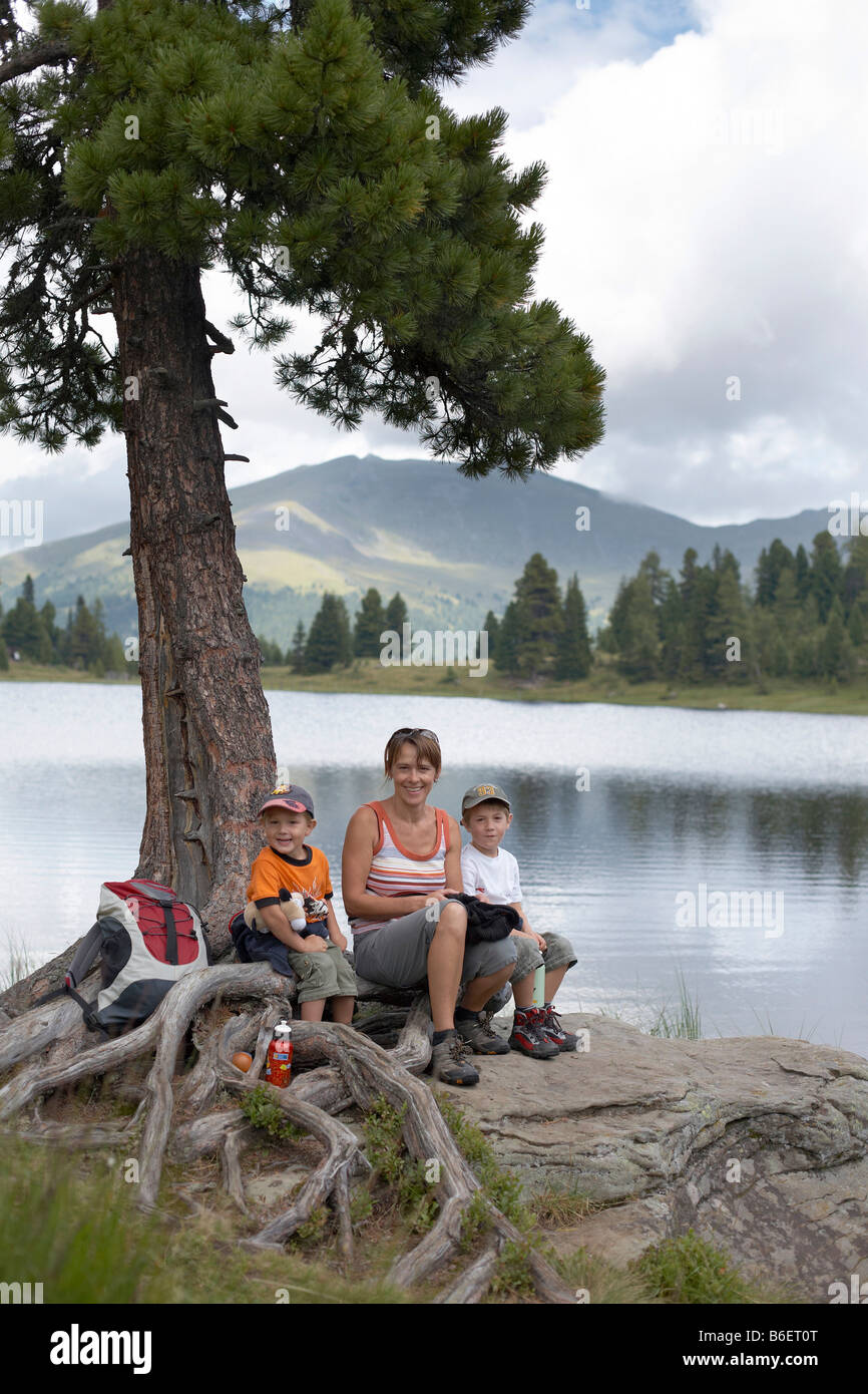 Woman and two children at the Gruensee Lake, Turracher Hoehe, Nockberge Mountains, Carinthia, Austria, Europe Stock Photo