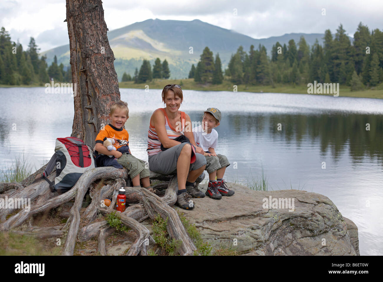 Woman and two children at the Gruensee Lake, Turracher Hoehe, Nockberge Mountains, Carinthia, Austria, Europe Stock Photo