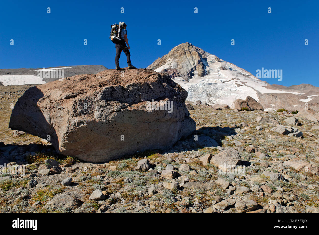 Mountain climber at the Eastern edge of Mount Hood volcano, Cooper Spur Trail, Cascade Range, Oregon, USA Stock Photo