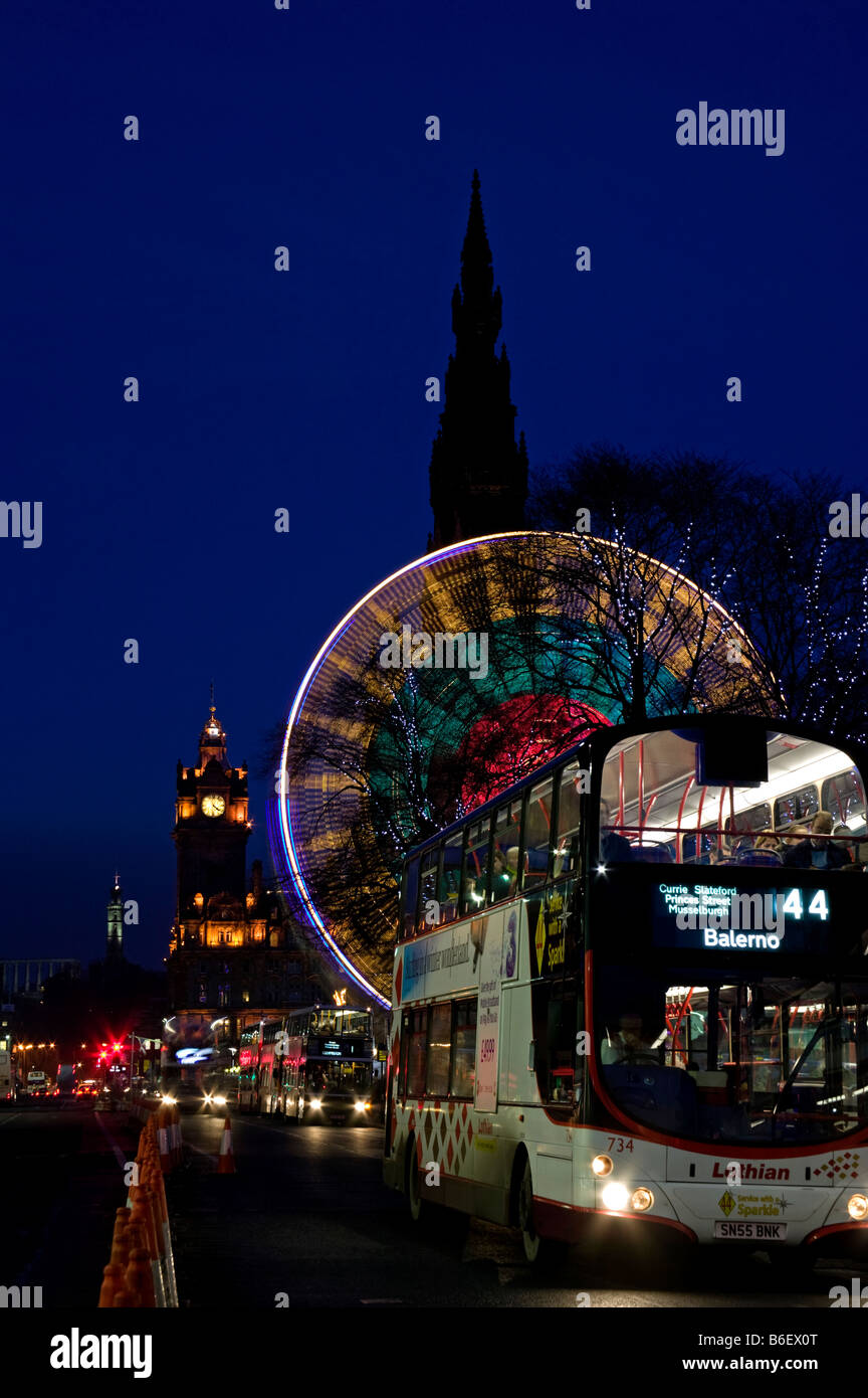 Dusk in Princes Street, Edinburgh with traffic and Ferris wheel during the festive season, Scotland, UK, Europe Stock Photo