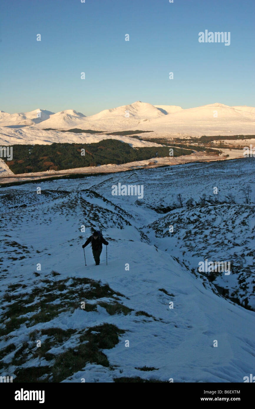 Hillwalker ascending Coire an Dothaidh to Beinn Dorain Black Mount Mountains in the background Stock Photo