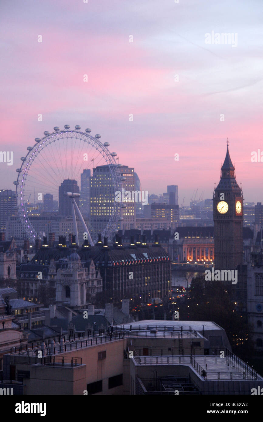 Dawn breaks over big Ben and the London Eye London UK Stock Photo