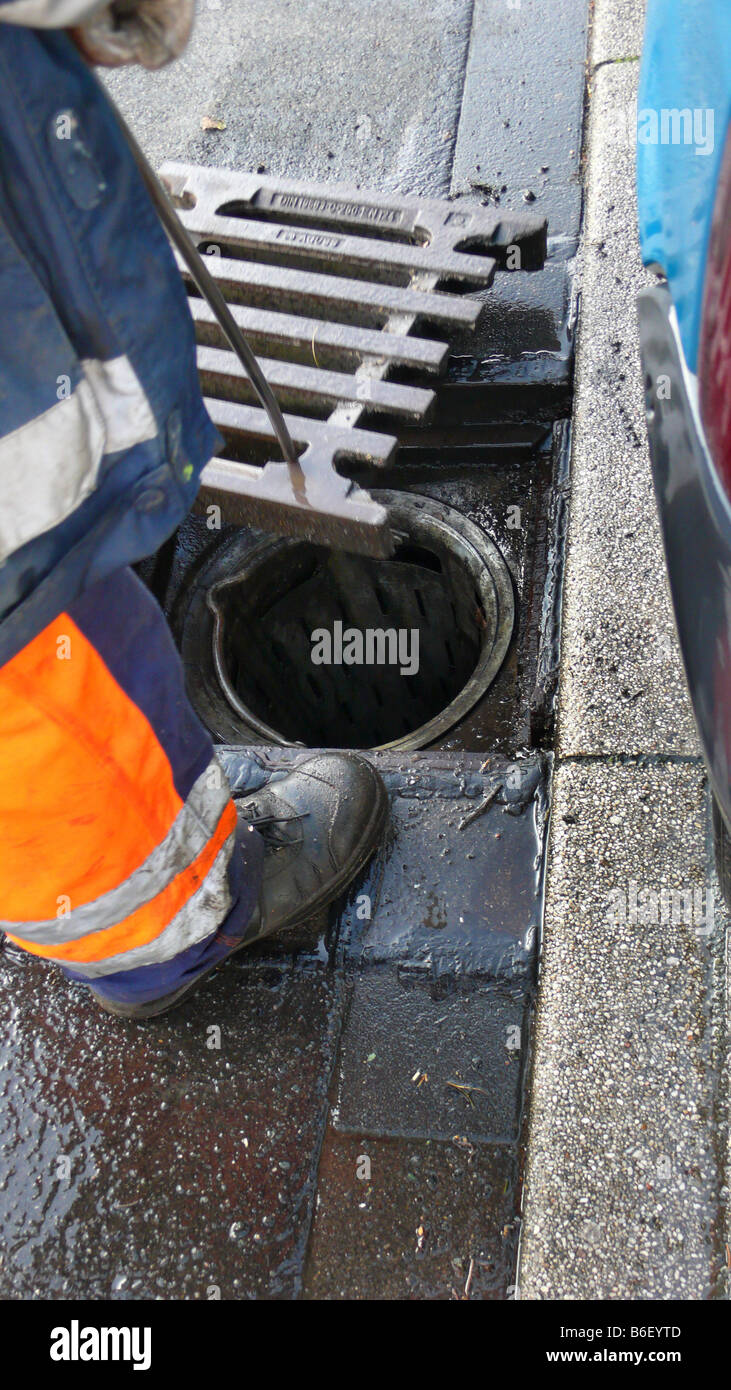 cleaning a storm drain, Germany Stock Photo Alamy