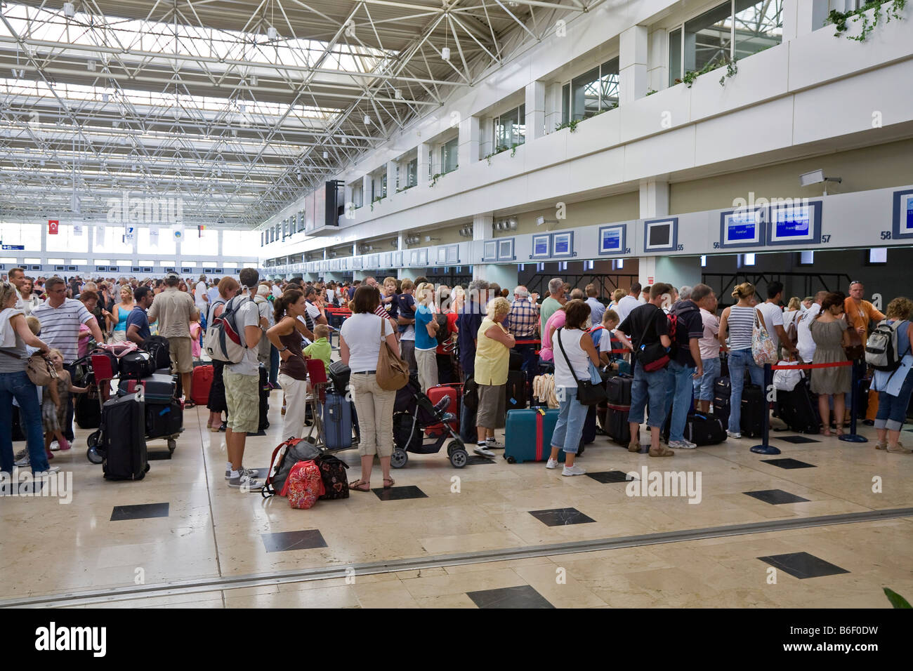 Check-in queue at Antalya Airport, Turkish Riviera, Turkey, Asia Stock Photo