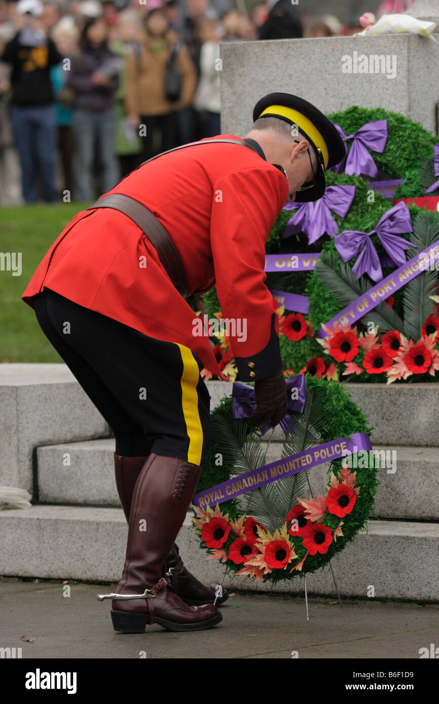 Royal canadian mounted police officer laying wreath at Armistice service Victoria British Columbia Canada Stock Photo