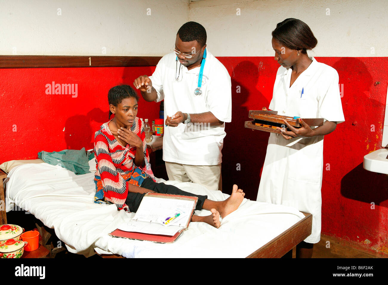 Examination and treatment of an AIDS/HIV patient in a hospital in