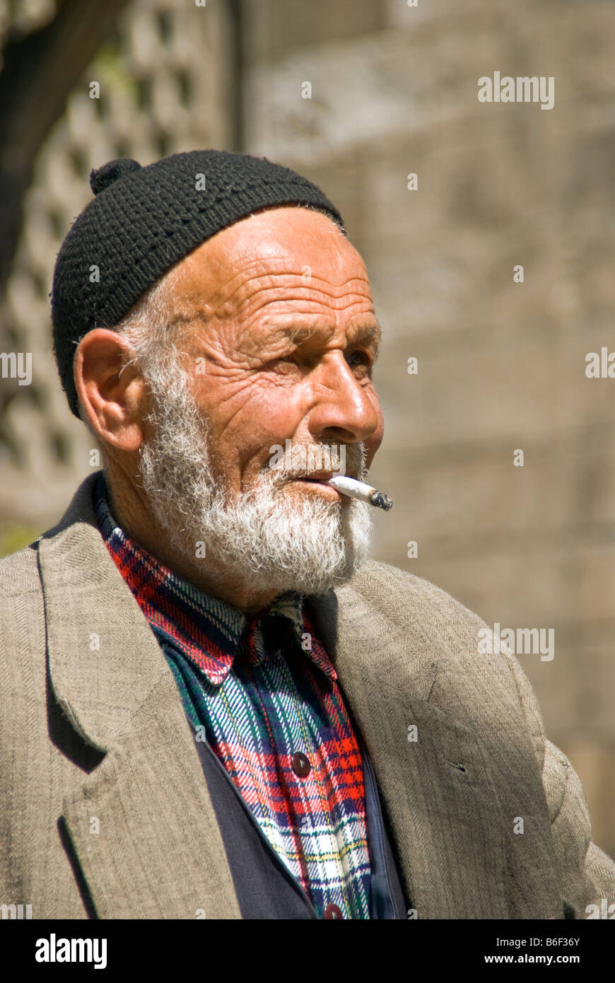 Elderly Turkish man smoking cigarette in Erzurum in Eastern Turkey Stock Photo