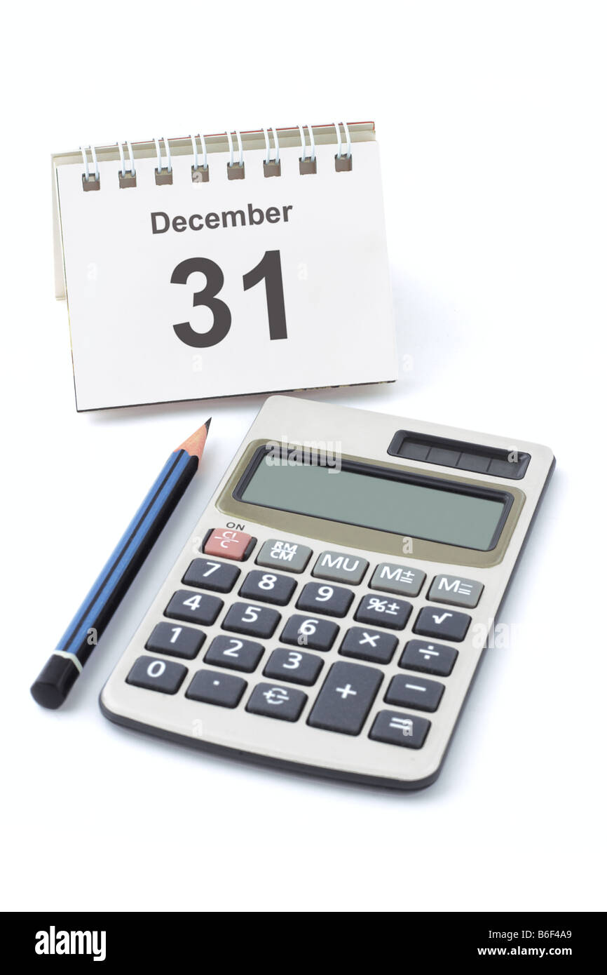 Calendar showing new year eve electronic calculator and pencil Stock Photo