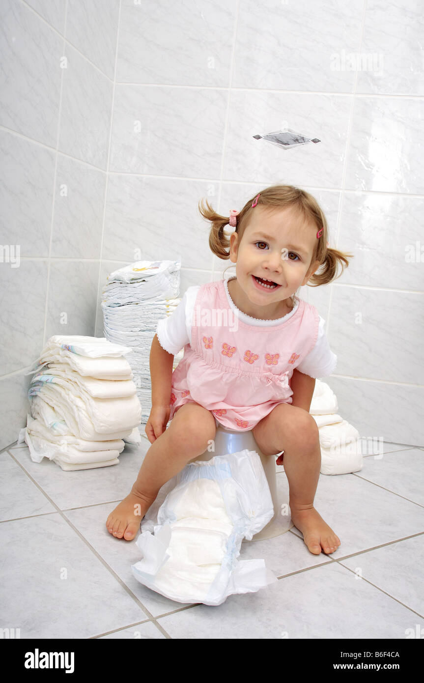 little girl sitting on potty potty training switzerland stock potty training little girls