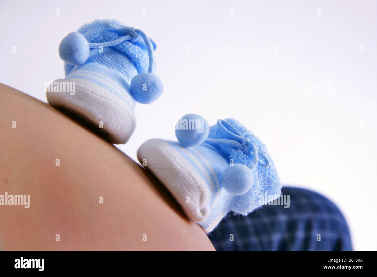 Byby Shoes On Pregnant Belly Stock Photo Alamy