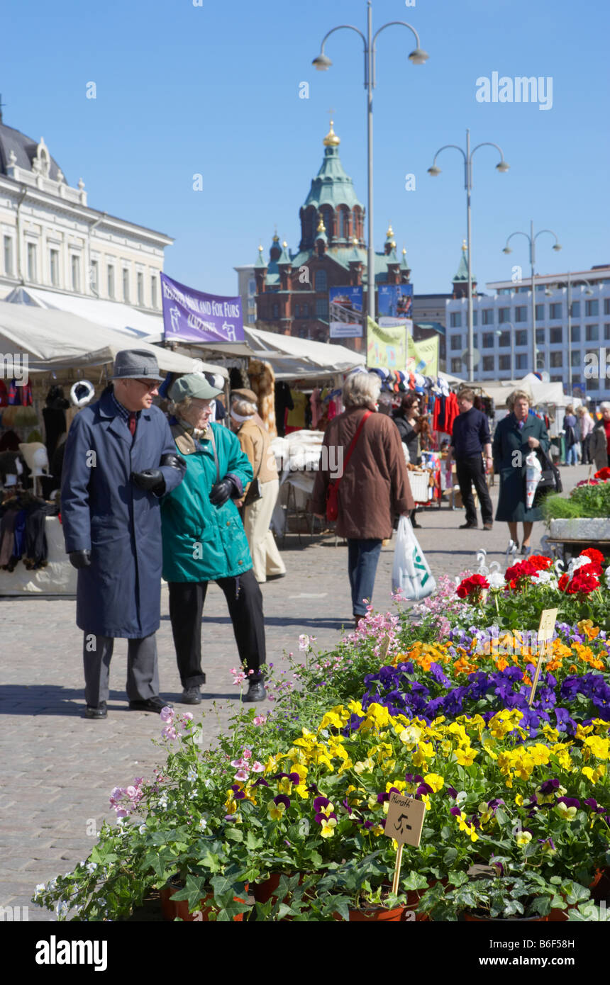 People looking at stalls in the Market Square Uspenski Cathedral in background Helsinki Finland Stock Photo