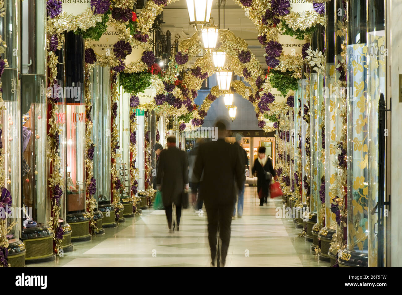 Shoppers in Piccadilly Arcade at Christmas time London United Kingdom Stock Photo