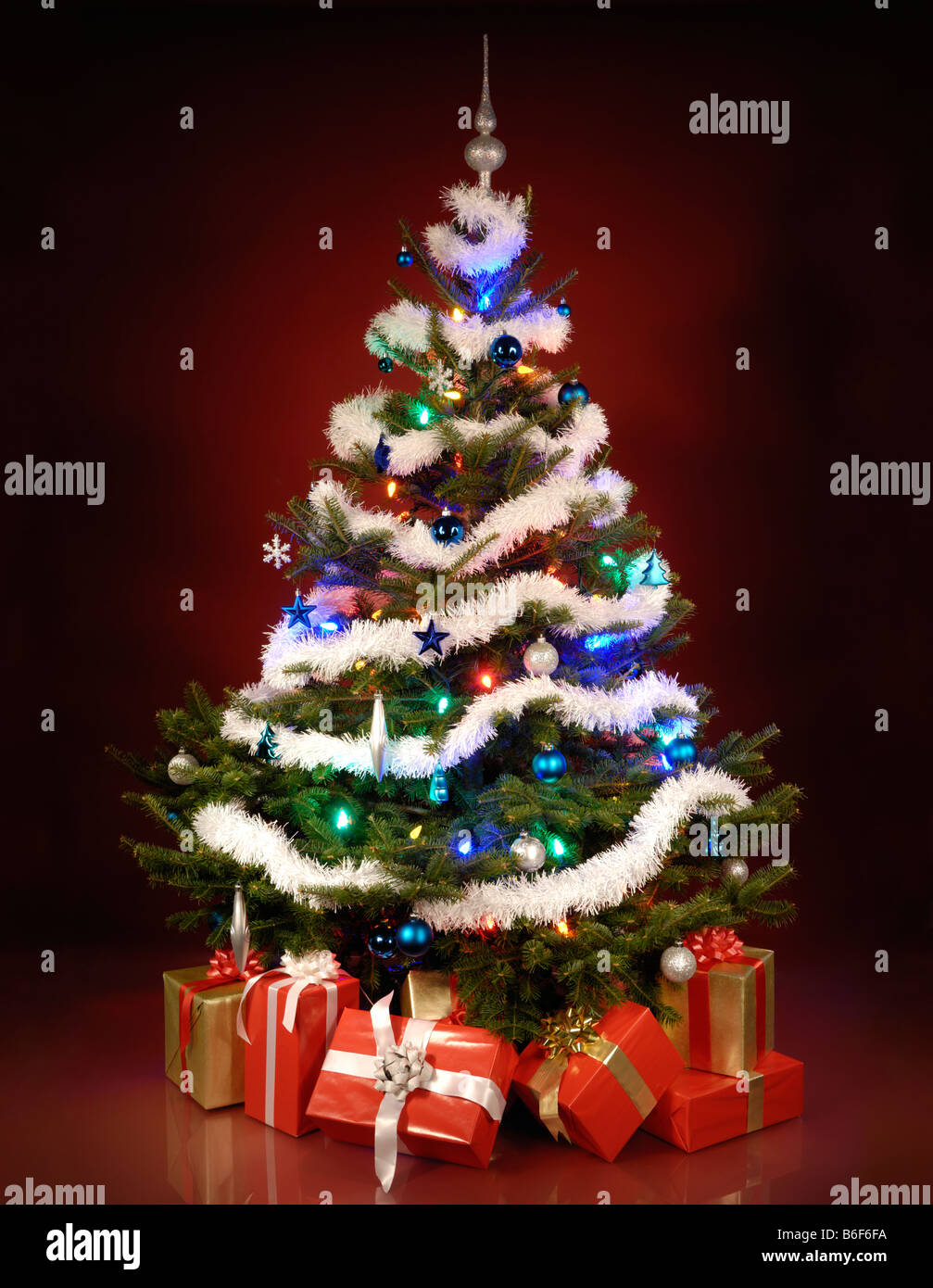 Shining Christmas Tree With Gifts Under It