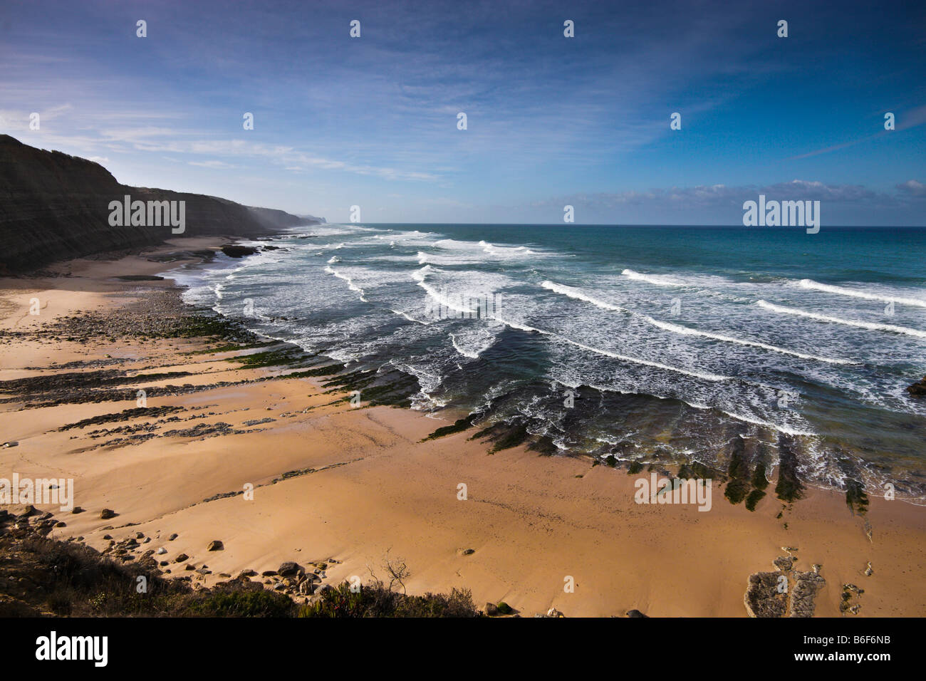 The west Coast of Portugal rising over the Atlantic Ocean is a place of sandy beaches waiting for travellers Stock Photo