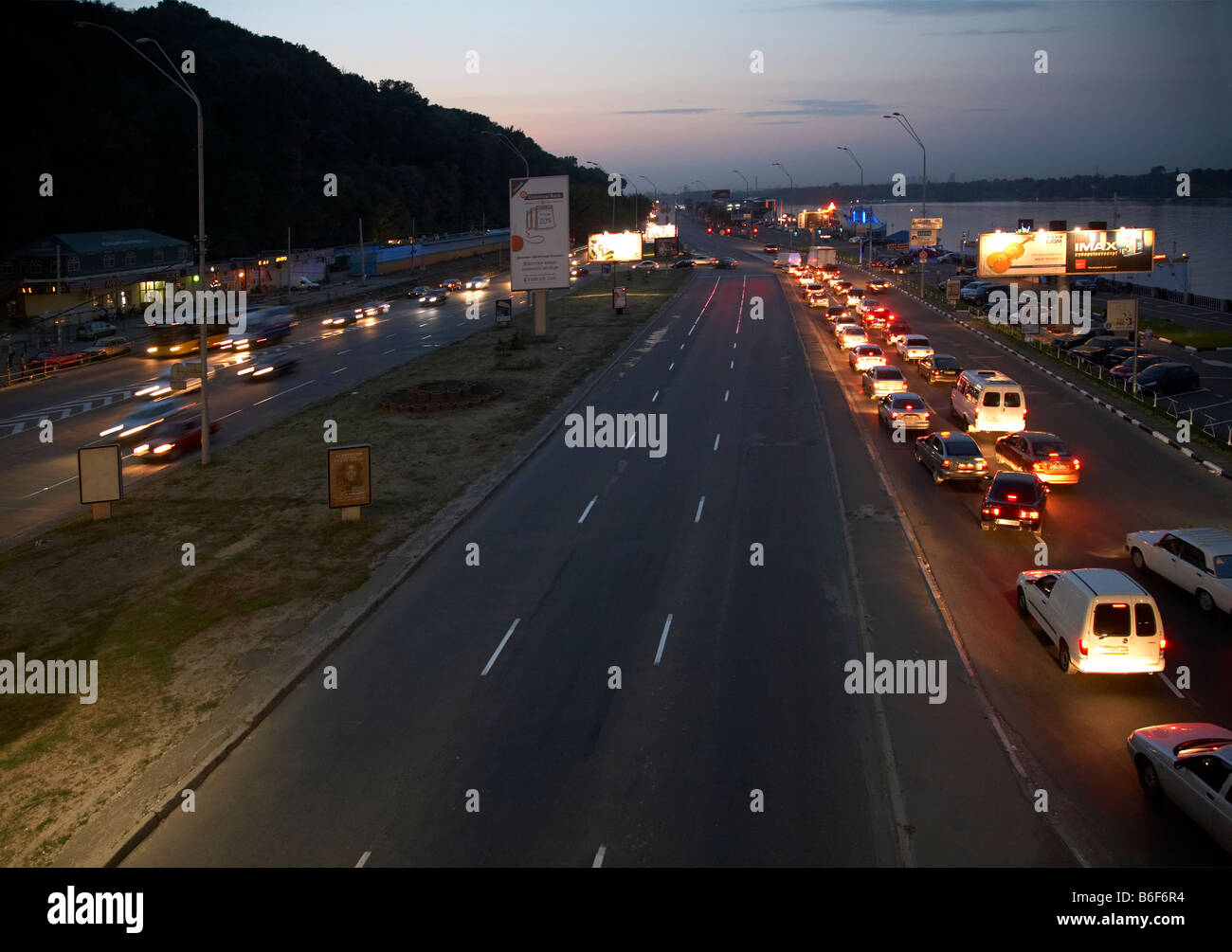 Evening Dnipro quay (Nabereghne Shose Street) scene (Kiev-City centre, Ukraine). Stock Photo