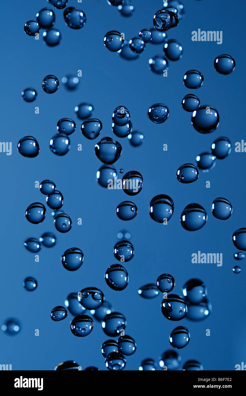 Water Droplets Against a Blue Background Stock Photo