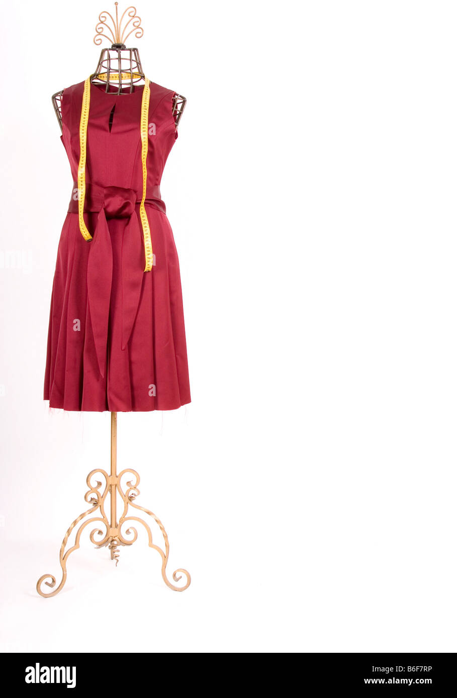 Tailor's dummy with a dress and tape measure Stock Photo