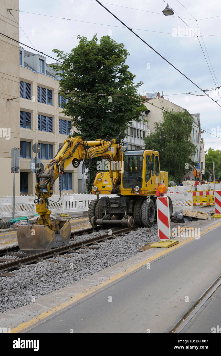 Construction site, tram track construction work, special digger on the rails Stock Photo Alamy