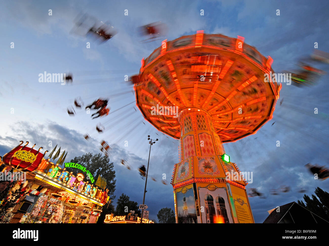 Night shot of swing carousel, Cannstatter Volksfest, Stuttgart, Baden-Wuerttemberg, Germany, Europe Stock Photo