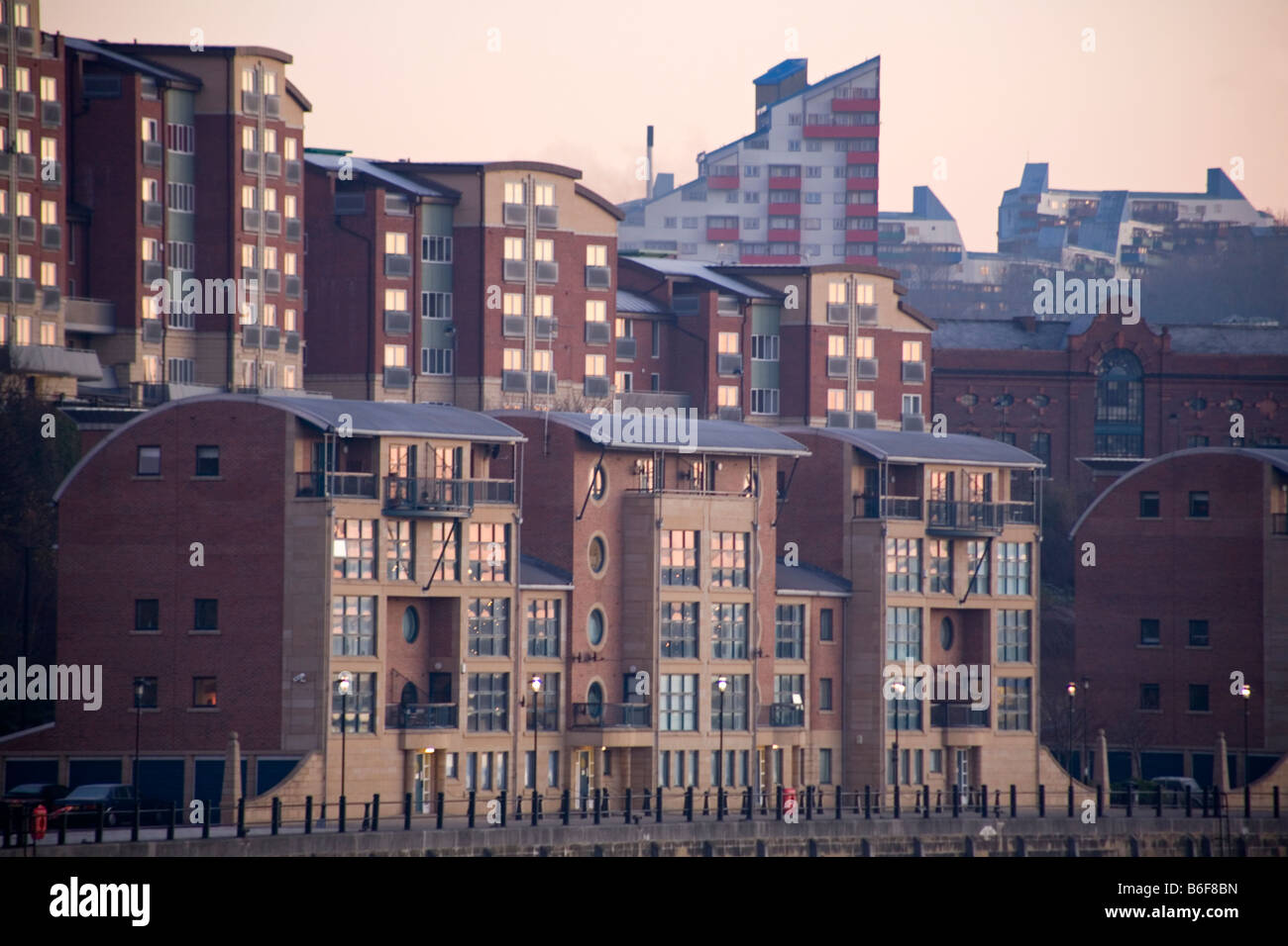 Riverside apartments on Newcastle upon Tynes quayside. With the Byker Wall in the background