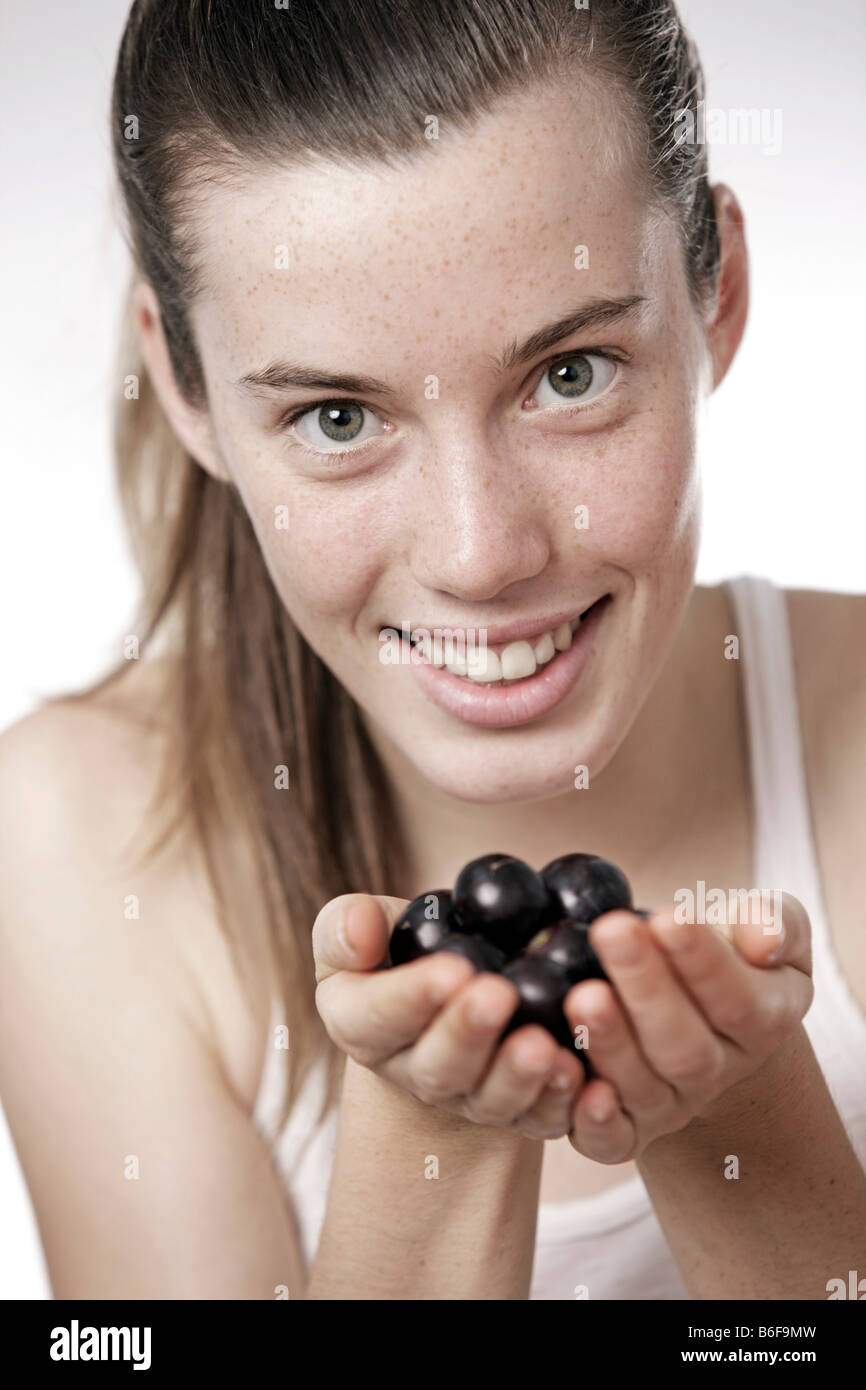 Teenage Girl Woman 17 Year old Holding Grapes Stock Photo Alamy