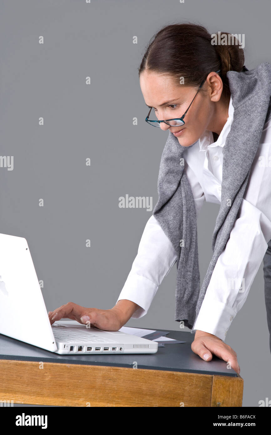 Woman working focused on laptop hi-res stock photography and images - Alamy
