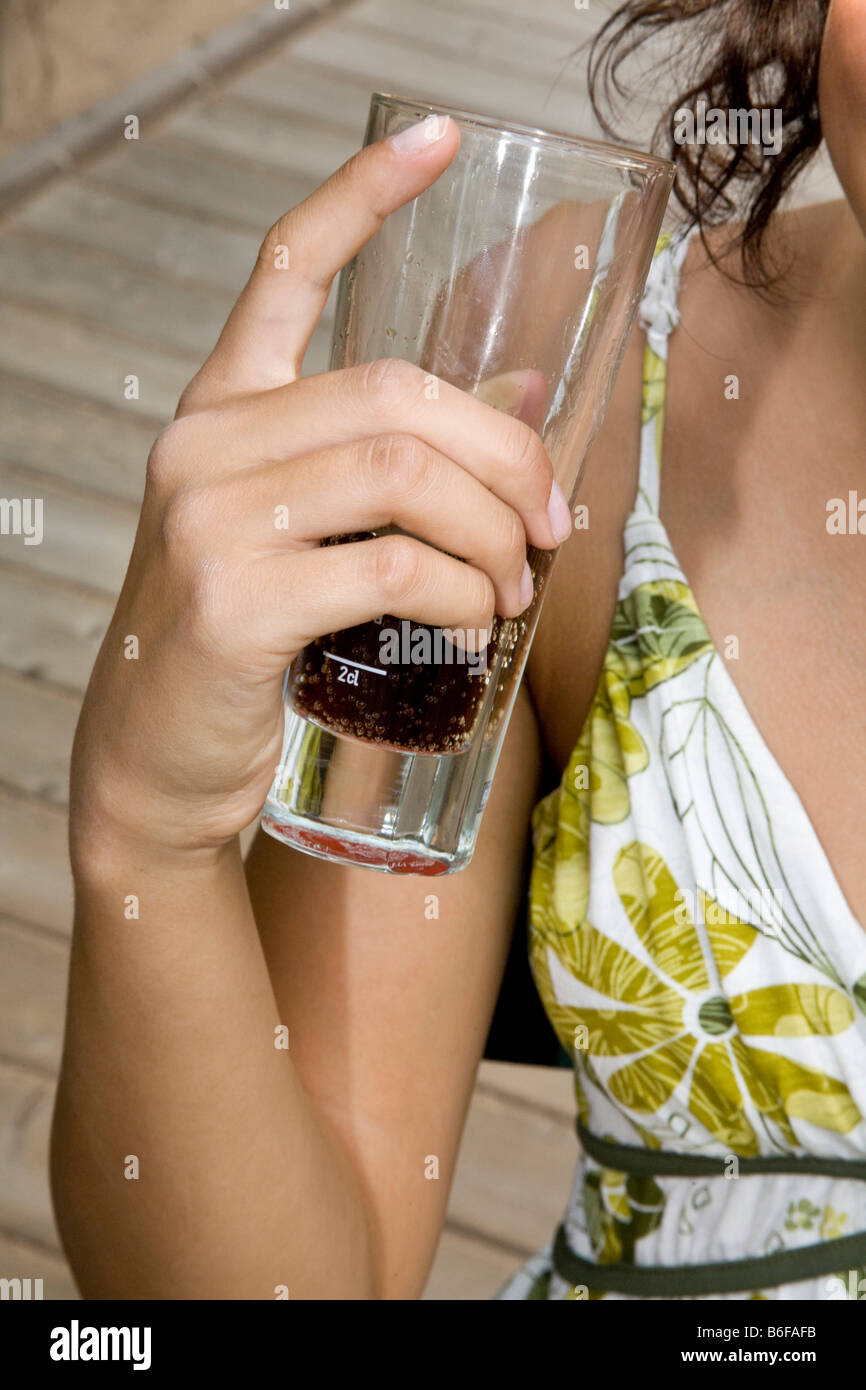Girl's hand holding a drink Stock Photo