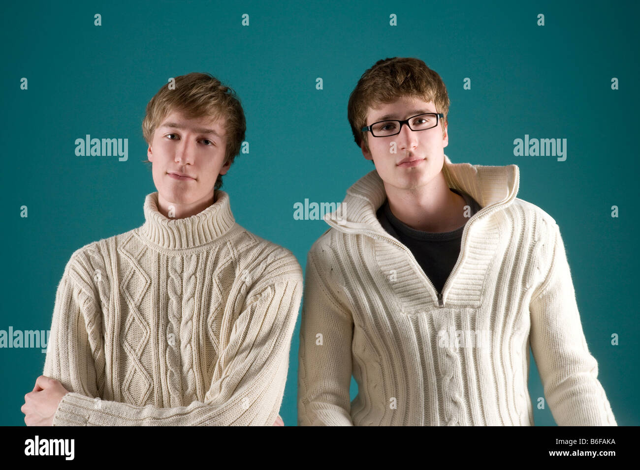 Two boys wearing knitted jumpers Stock Photo Alamy
