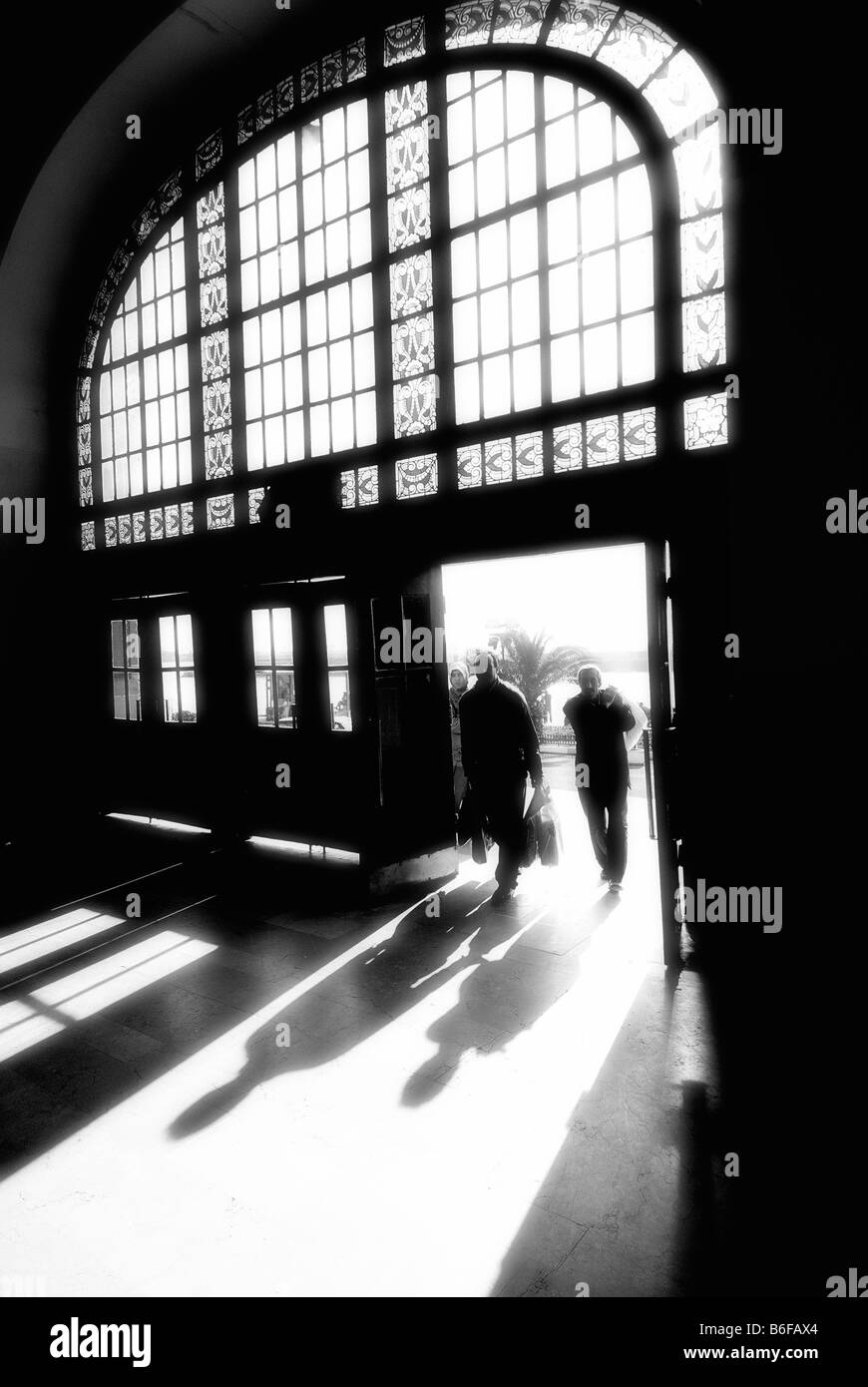 human silhouettes at the train station Stock Photo - Alamy