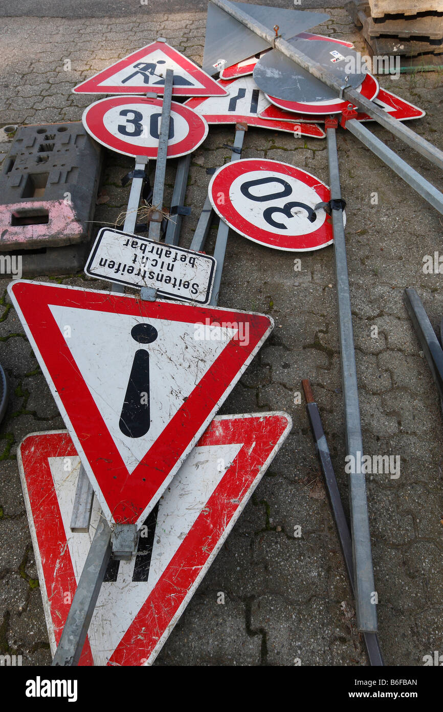 Traffic signs lying on the ground Stock Photo