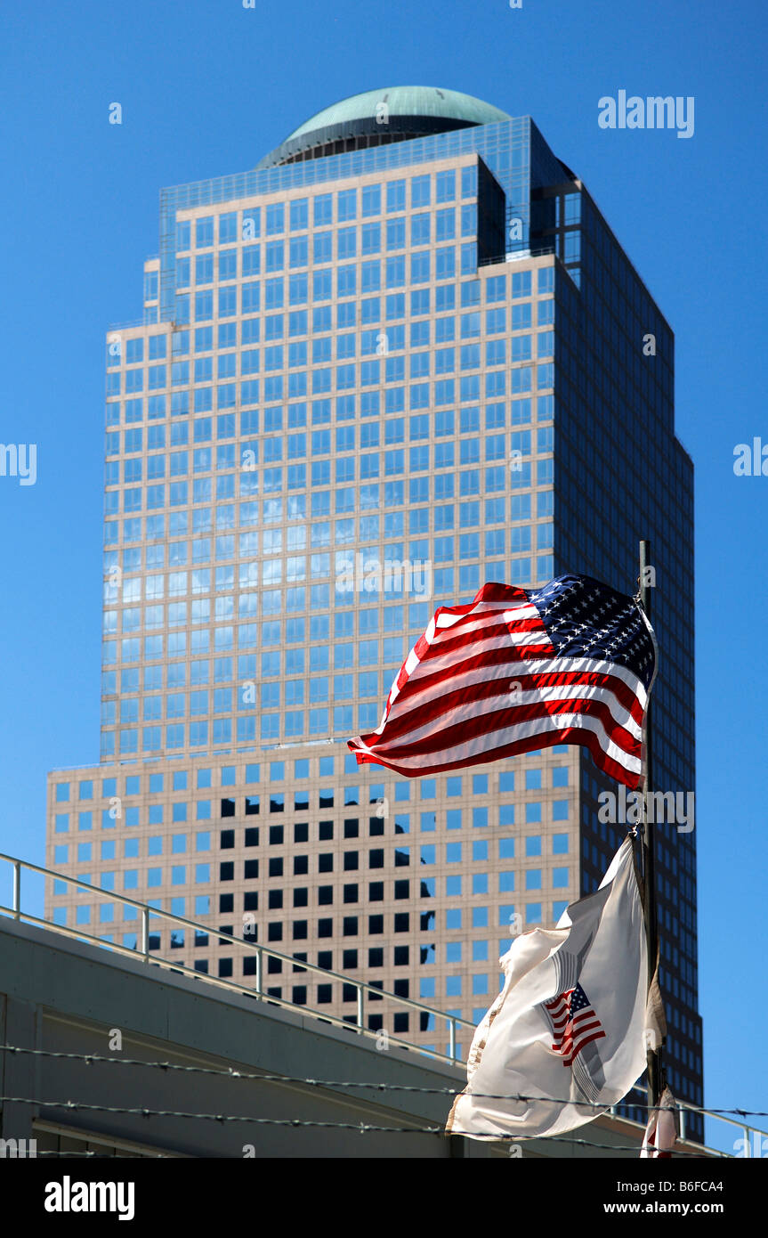 US flag at a restricted area of Ground Zero in front of a high-rise office building, New York City, USA Stock Photo